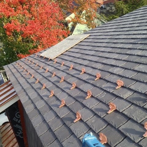 Copper ridge cap and copper valley detail